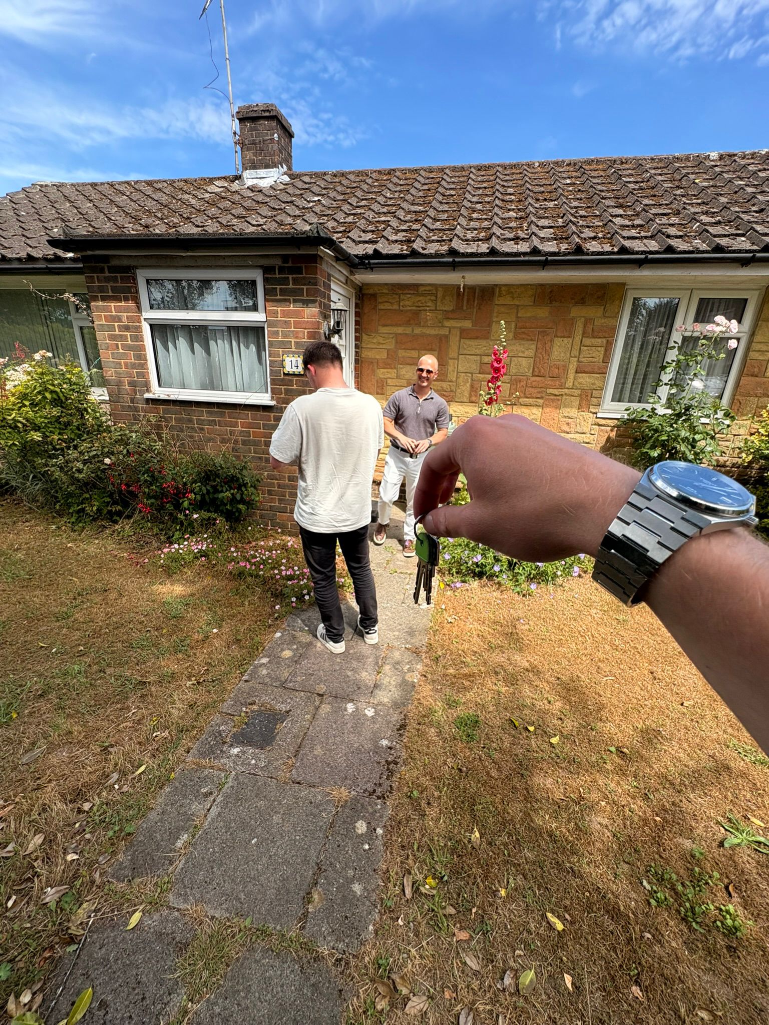 A buyer collecting the keys to a property they secured