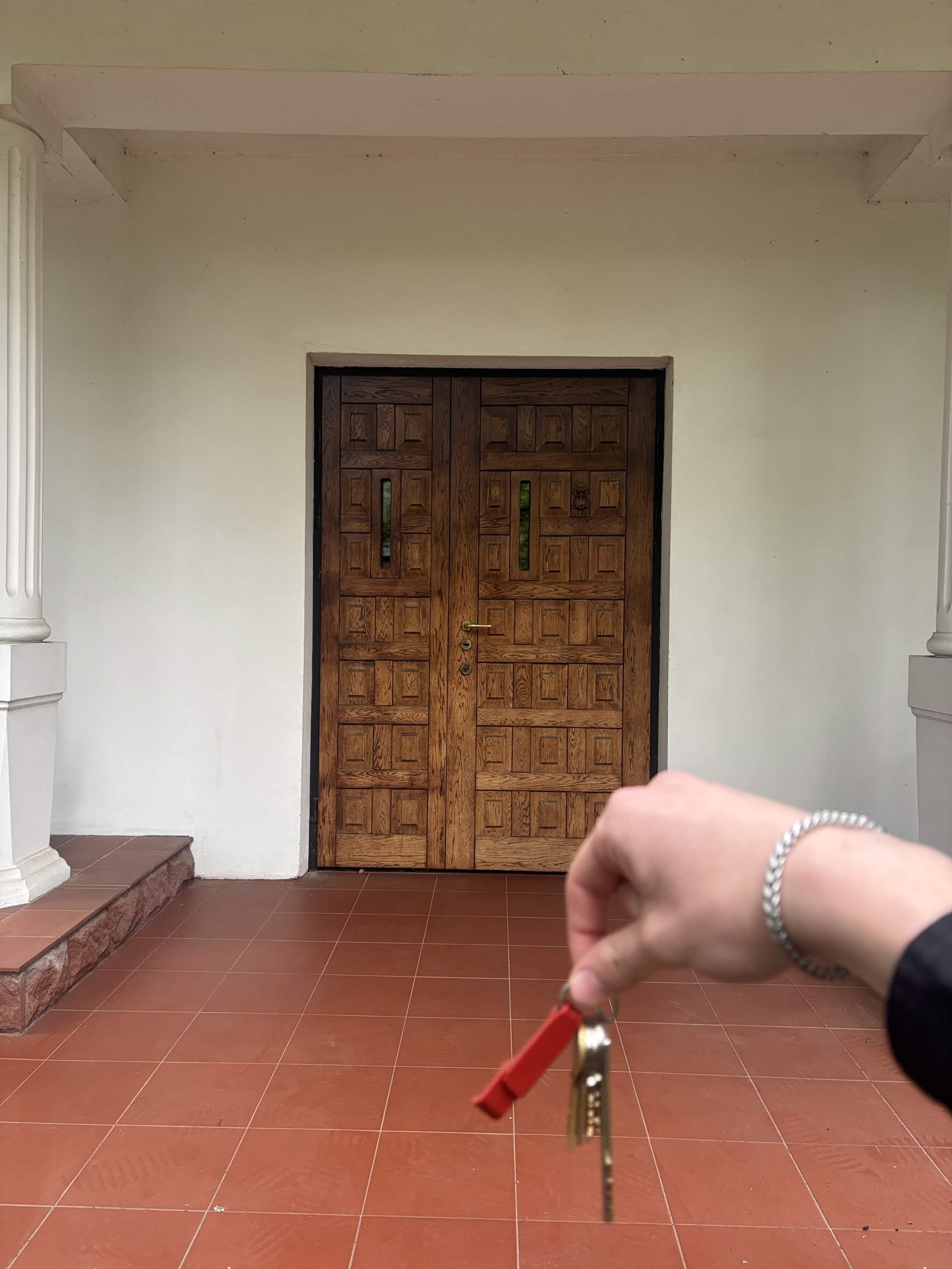 A buyer collecting the keys to a property they secured